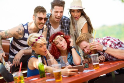 Crazy youngsters fooling around while photographing selfie